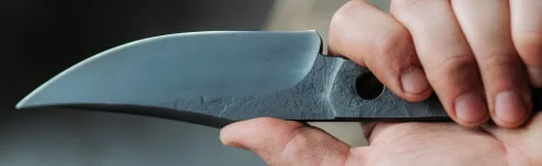 Bladesmith holding a freshly forged knife