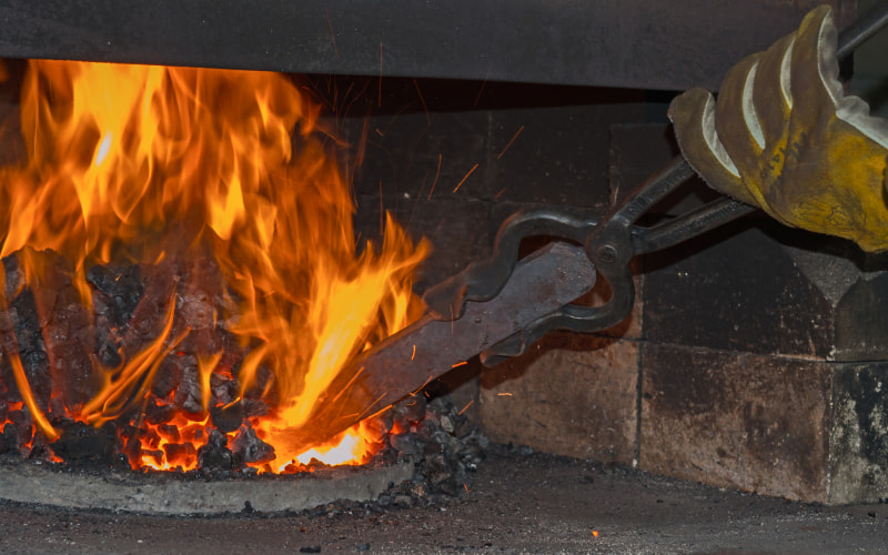 Steel bar being heated in a forge