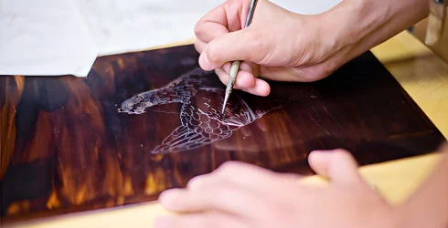 Illustration being etched into the plate