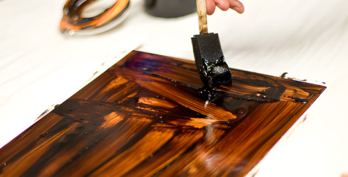 Resist being painted onto metal plate