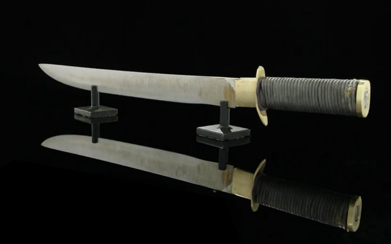 Forged in fire contestant Erik Hemker blade on display