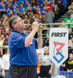 Ref blowing a horn starting a BattleBots match