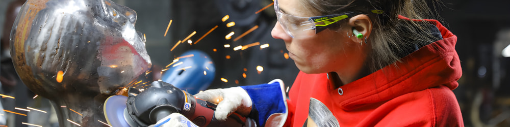 Barbie Shaving some fine details into a metal bust