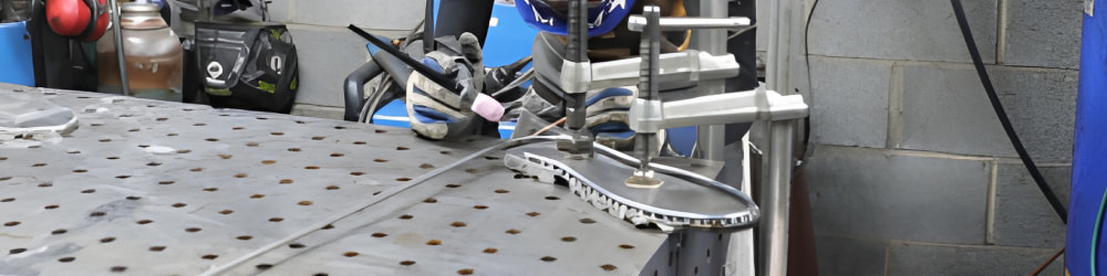 A shot of Barbie working at her welders work bench