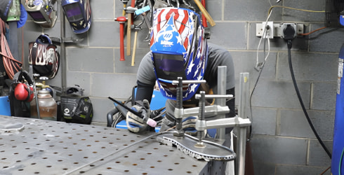 A shot of Barbie working at her welders work bench