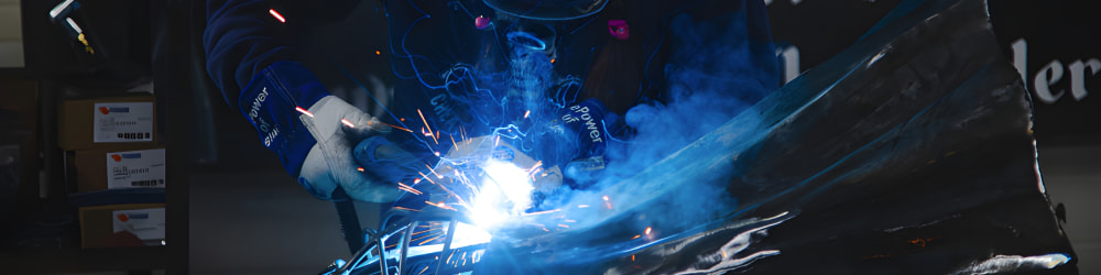 Barbie welding an in progress sculpture