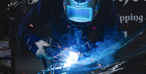 Barbie welding an in progress sculpture