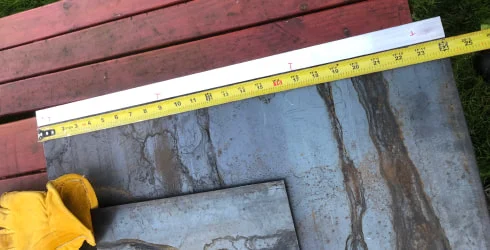 Measuring a piece of weathered steel