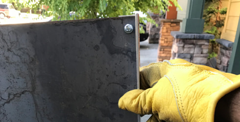 Holding a drilled piece of weathered steel