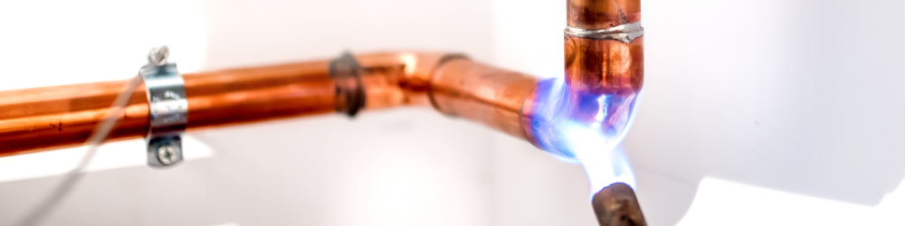 Heating up a piece of copper tubing with torch