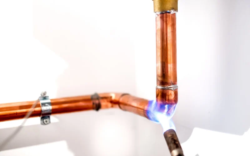 Heating up a piece of copper tubing with torch