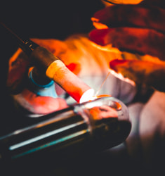 Welder welding a stainless steel tube