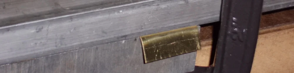 Sheet of brass being bent in a vice