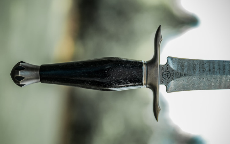Brass and wood dagger handle and damascus steel blade