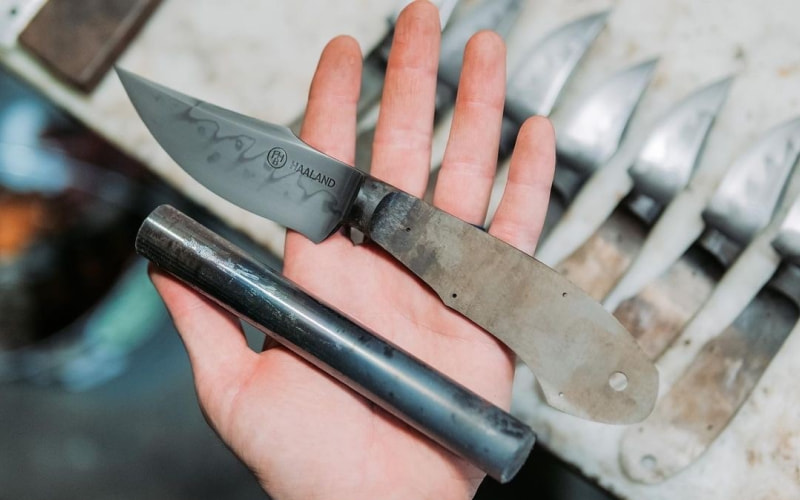 freshly made Curt Haaland knife in the palm curts hand