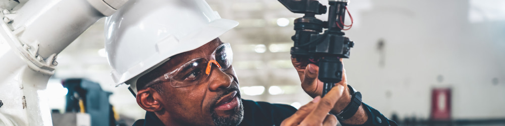 Engineer working on robot