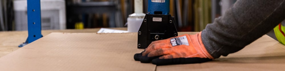 An online metals package being stappled and ready for shipping