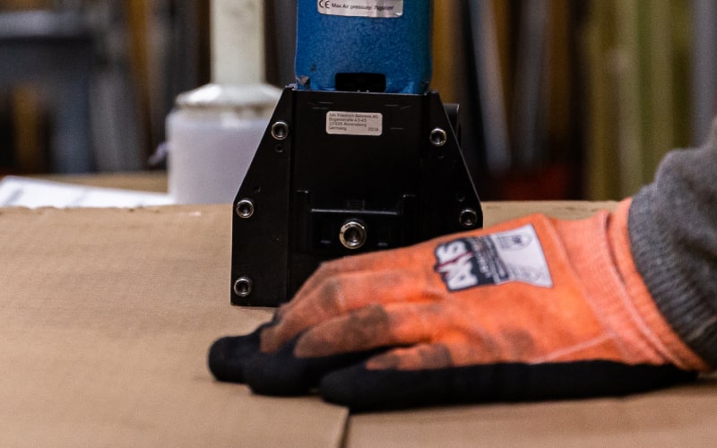An online metals package being stappled and ready for shipping